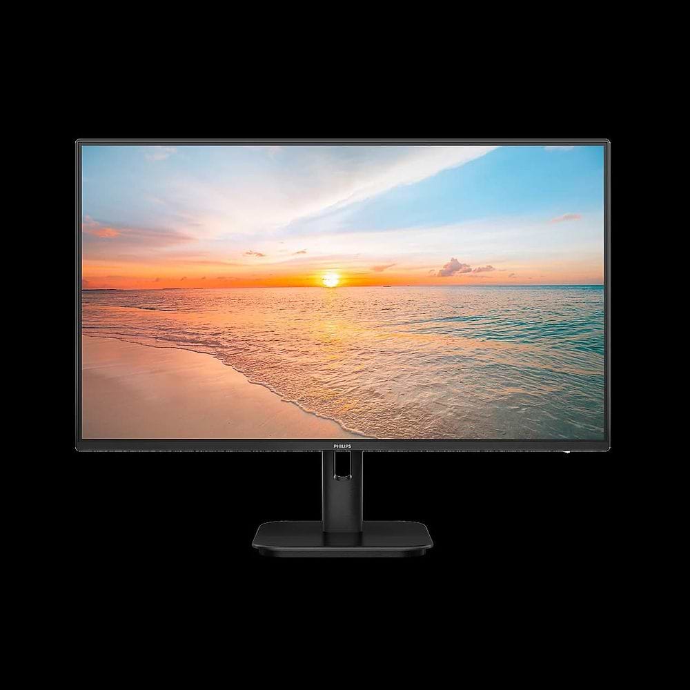 צג מחשב Philips בצבע שחור בעיצוב מודרני ומינימליסטי. הצג כולל מסגרת דקה סביב המסך ומעמד מרכזי מלבני עם בסיס שטוח ויציב. על גבי המסך מוצגת תמונת נוף של חוף ים בשעת שקיעה, עם שמיים בגווני כתום, ורוד וכחול המשתקפים במים. התמונה מדגישה את שטח התצוגה הרחב ואת 